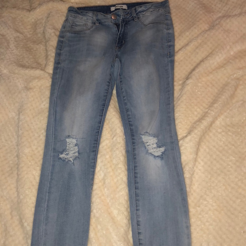 5/20 Distressed light wash jeans.